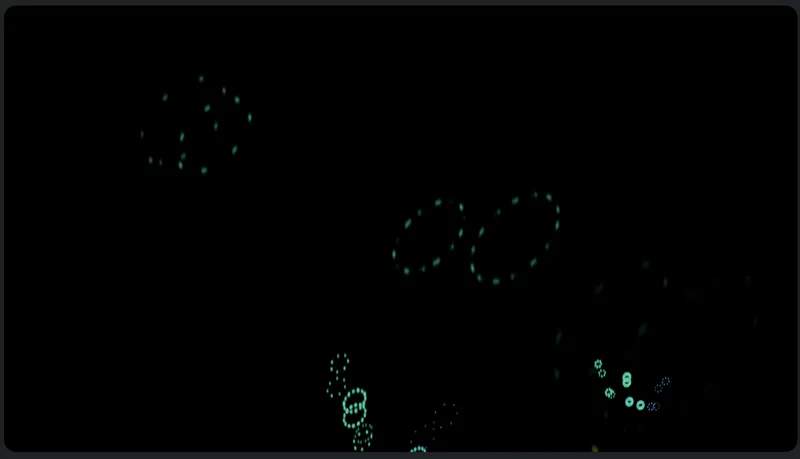 Small cyan particle rings glow against black.